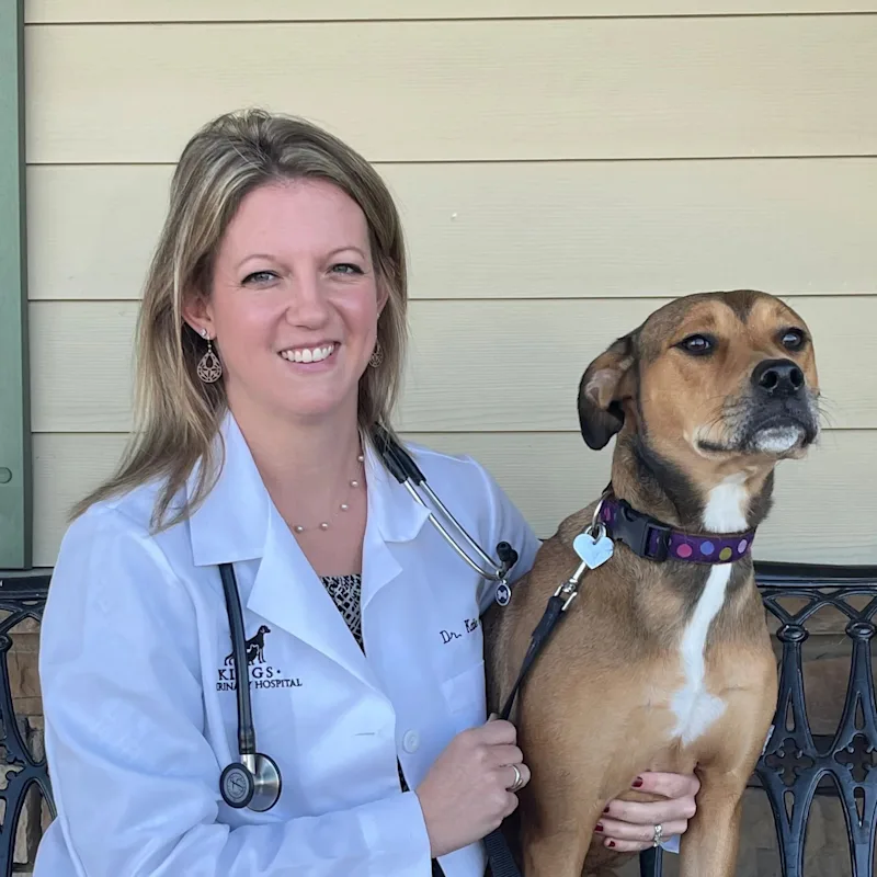 Dr. Katie Freson with a brown dog Dr. Katie Freson with a brown dog