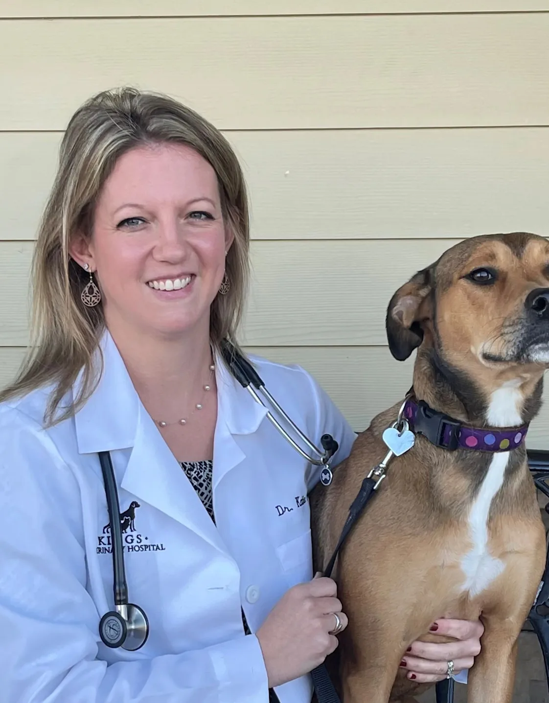 Dr. Katie Freson with a brown dog Dr. Katie Freson with a brown dog
