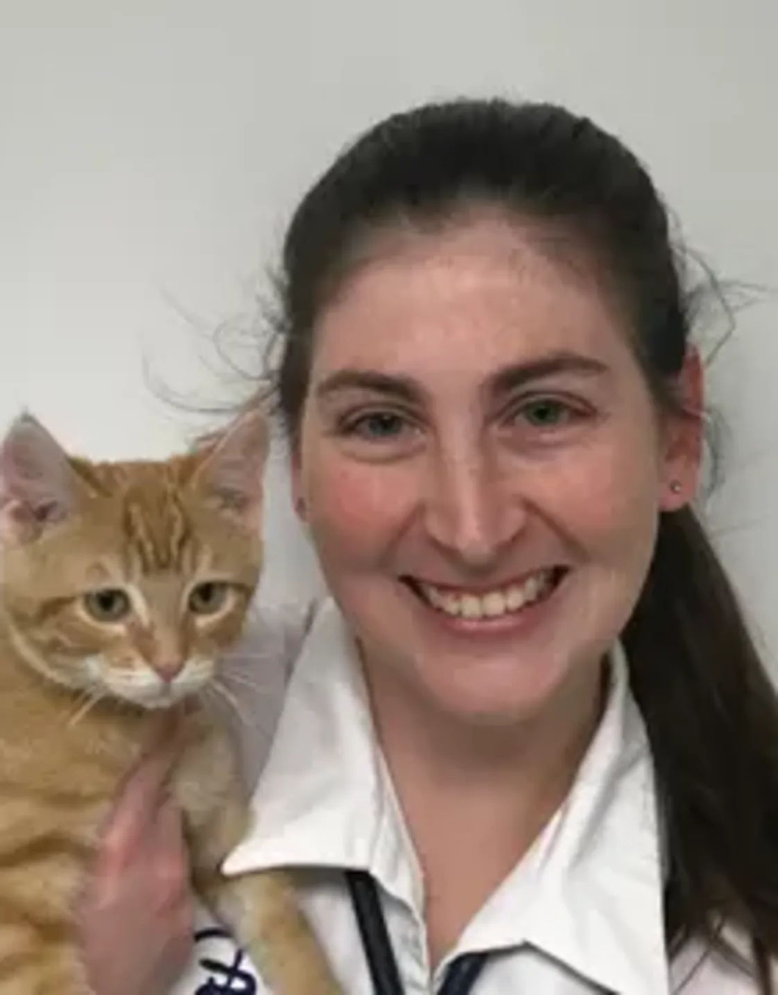 Dr. Jennifer Wallace and cat on her shoulder Dr. Jennifer Wallace and cat on her shoulder
