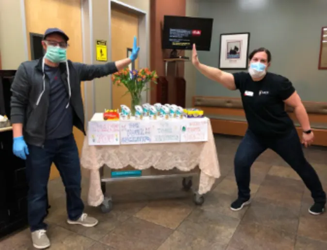 Two Veterinarians Giving Each Other a High-Five at SAGE Veterinary Center Two Veterinarians Giving Each Other a High-Five at SAGE Veterinary Center