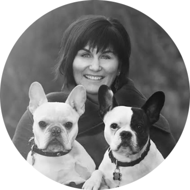 Dr. Geri Reimer holding up two of her dogs for a portrait picture Dr. Geri Reimer holding up two of her dogs for a portrait picture