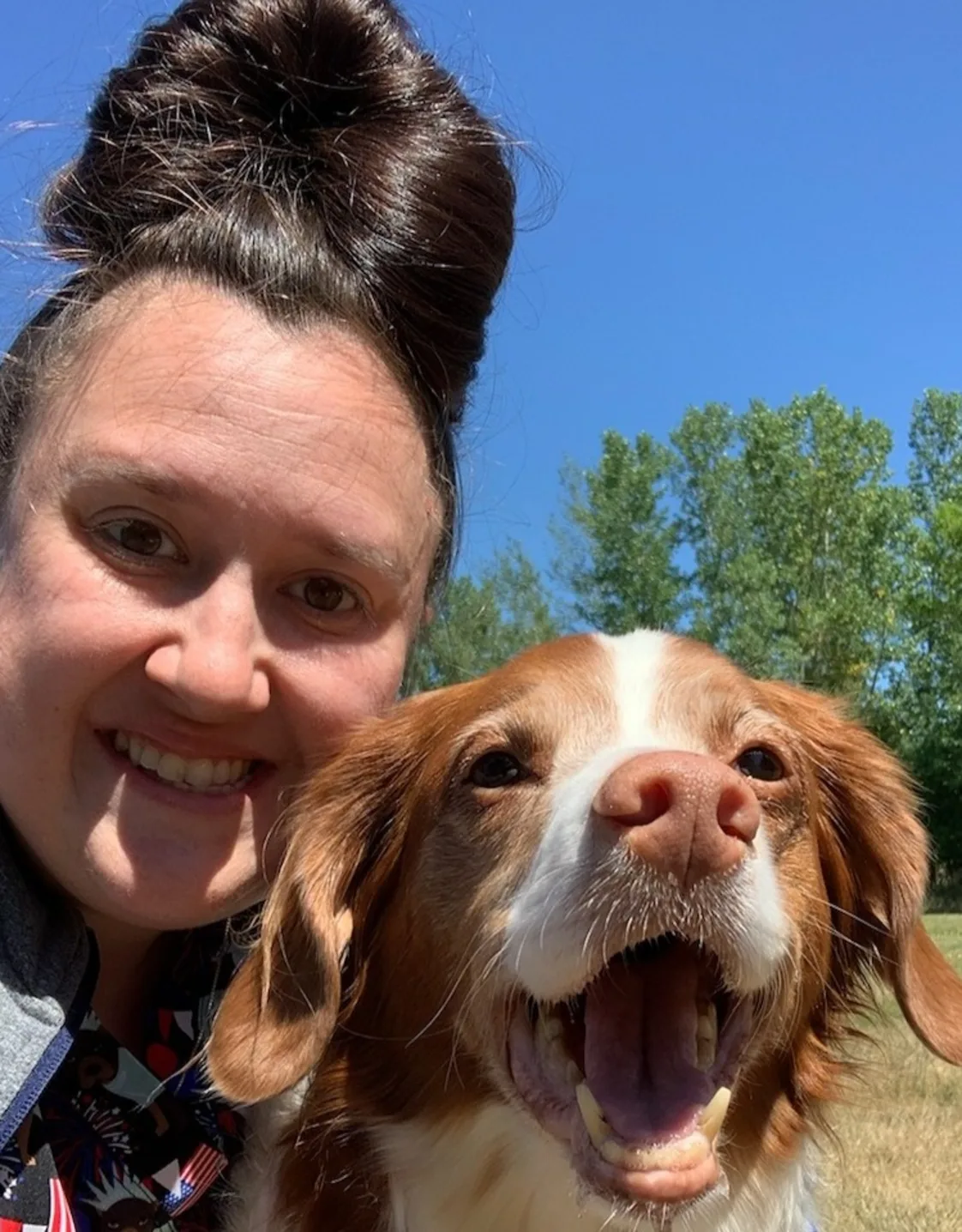 Jana's staff photo from Stillwater Veterinary Clinic posing with her little poodle outside. Jana's staff photo from Stillwater Veterinary Clinic posing with her little poodle outside.