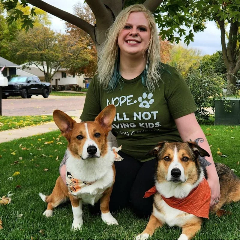 Abby's staff photo from Heather Ridge Pet Hospital where she is holding her black and white cat with her two black and white dogs on each side of her. Abby's staff photo from Heather Ridge Pet Hospital where she is holding her black and white cat with her two black and white dogs on each side of her.