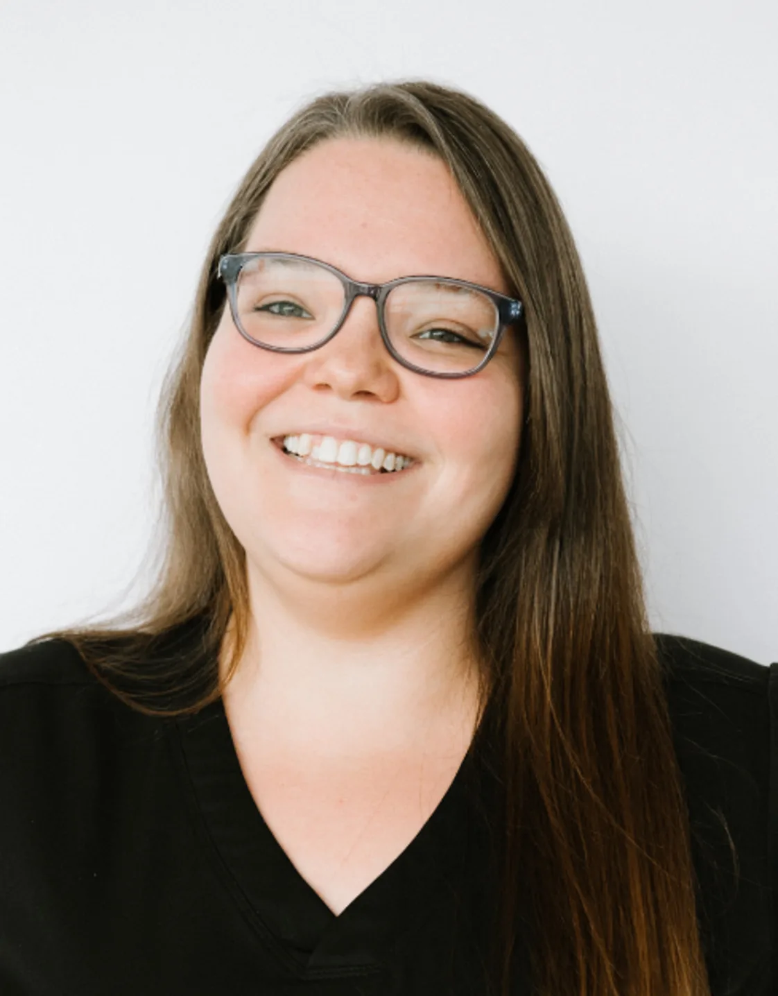 A portrait photo of receptionist Katie A portrait photo of receptionist Katie