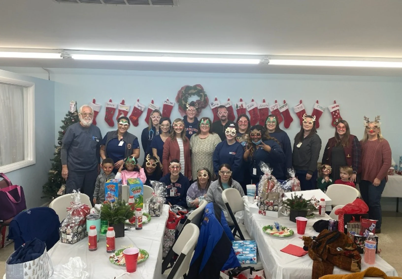 The staff at Animal Emergency and Critical Care posing at a holiday party