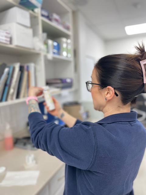 Our Staff Member Examining Medicine