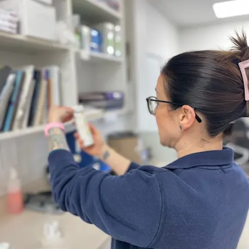 Our Staff Member Examining Medicine Our Staff Member Examining Medicine