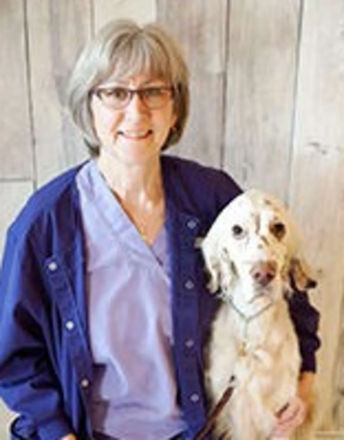 Betty Caldwell with a dog under her arm Betty Caldwell with a dog under her arm
