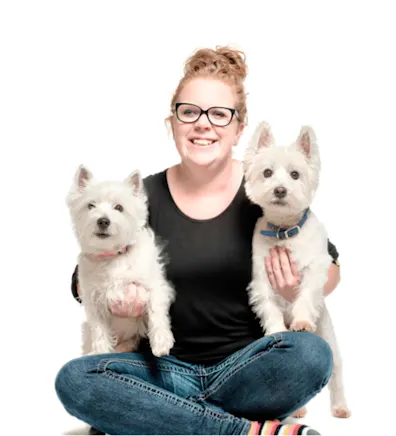 Portrait photo of Client Care Specialist Katie with her two dogs Portrait photo of Client Care Specialist Katie with her two dogs