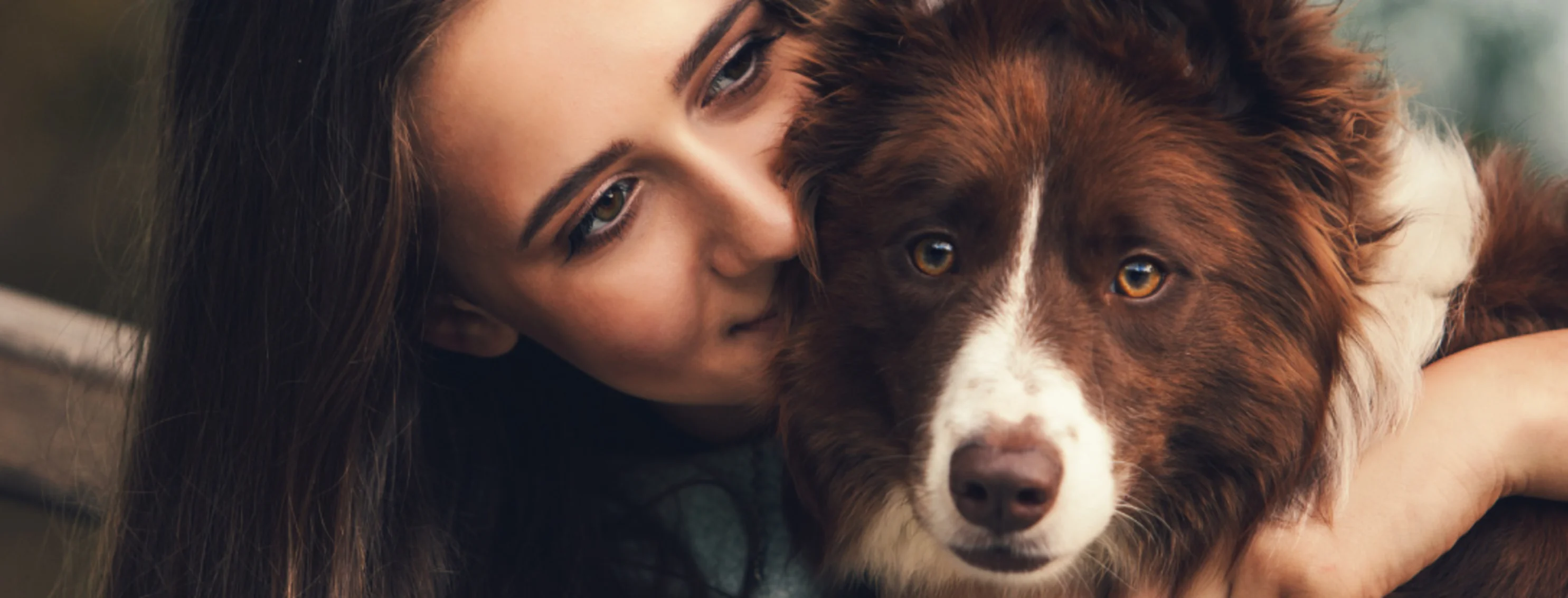 Woman with dog on bench