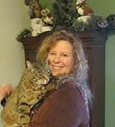 Julie Rader holding cat in her arms