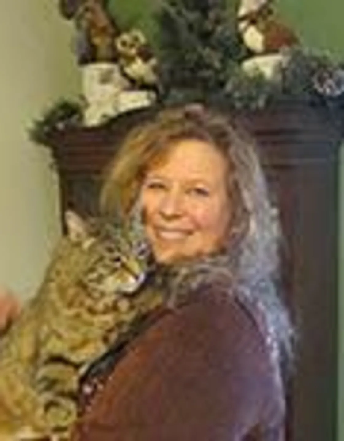 Julie Rader holding cat in her arms Julie Rader holding cat in her arms