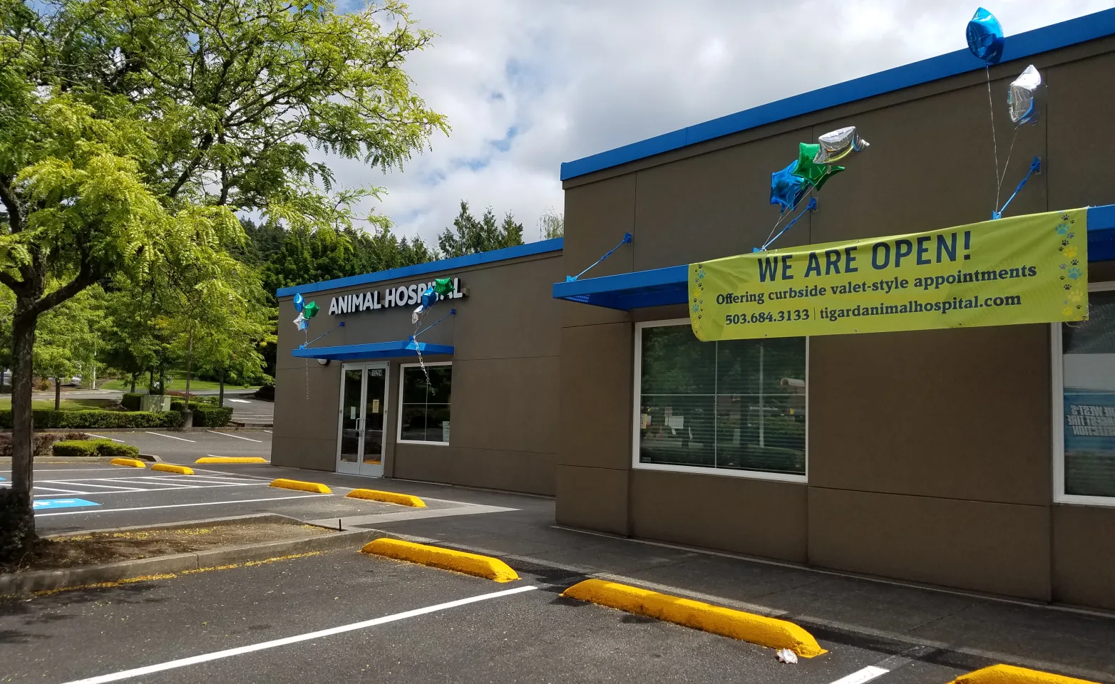 Future home of Tigard Animal Hospital with "We are Open!" sign