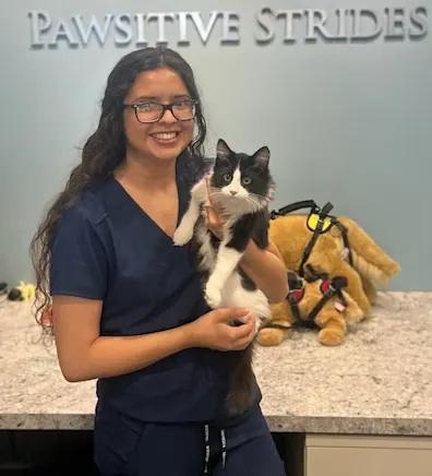 Hemili holding a black and white cat. Hemili holding a black and white cat.