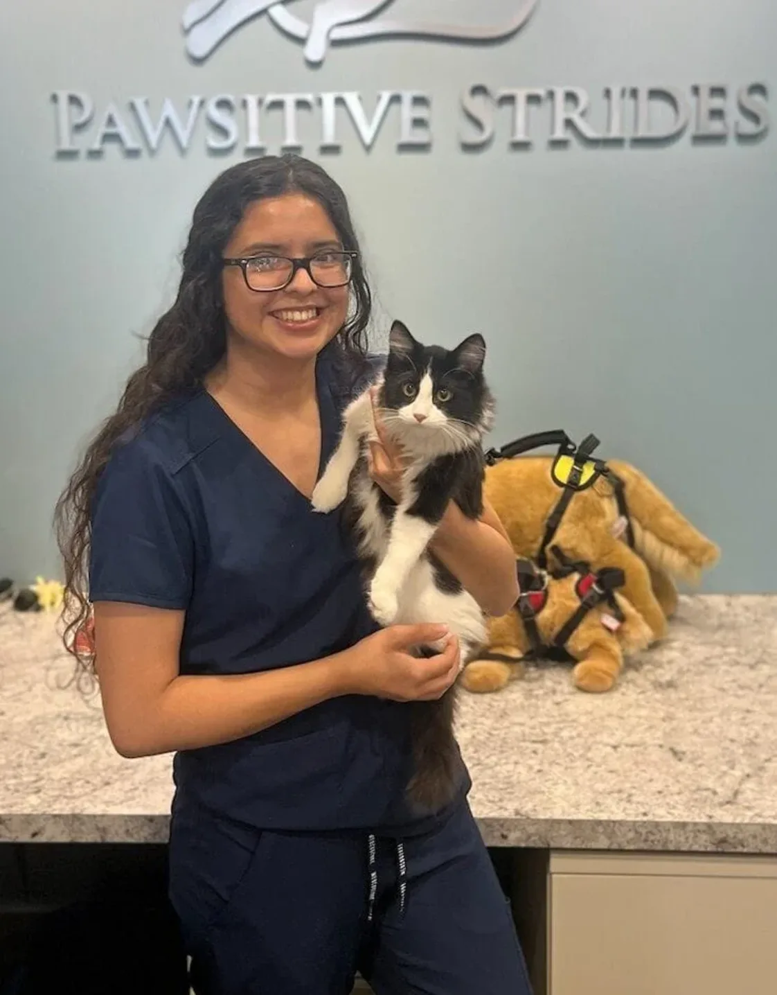 Hemili holding a black and white cat. Hemili holding a black and white cat.