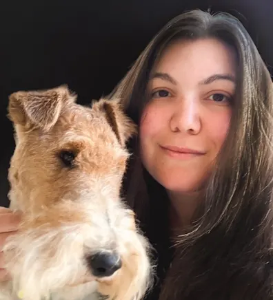 Sanlando Springs Animal Hospital's groomer, Leslie with a dog.