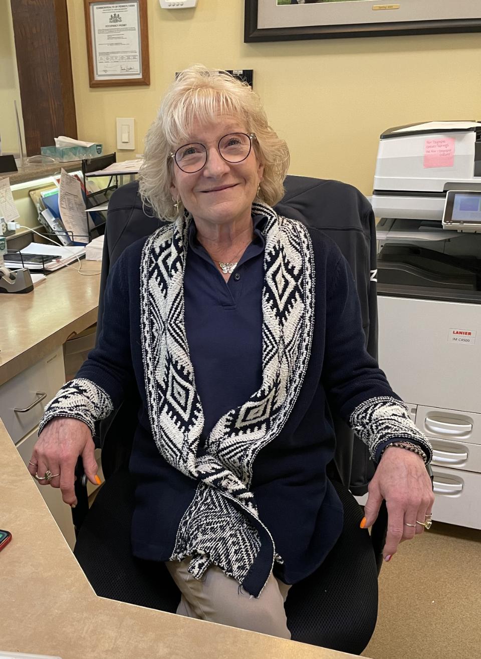 Karen I. sitting down at reception