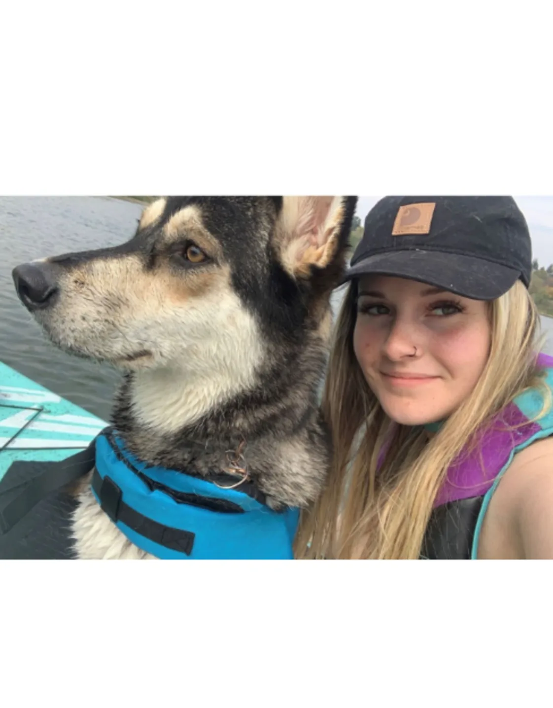 Brooke Chubey on a canoe with a dog Brooke Chubey on a canoe with a dog