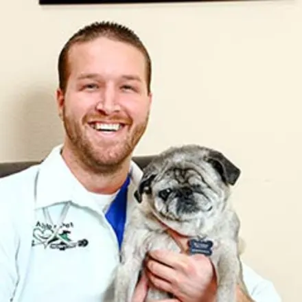 Dr. Eric Hannon holding pug
