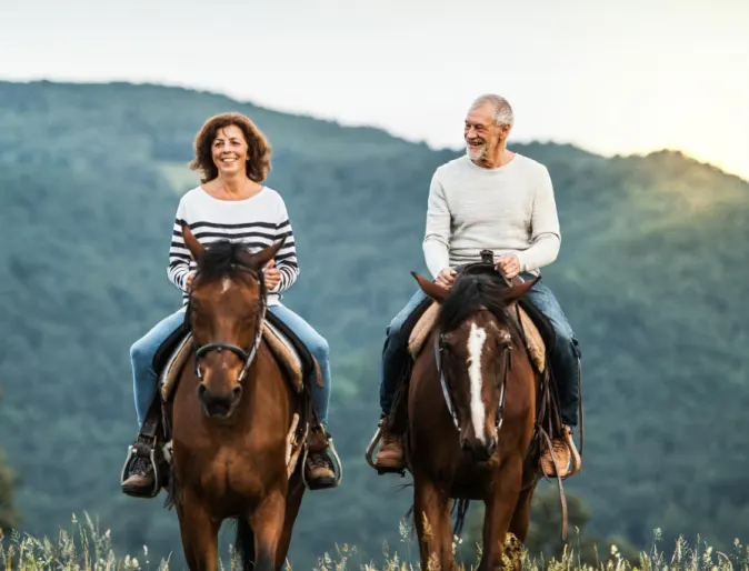 Man & Woman riding horses Man & Woman riding horses