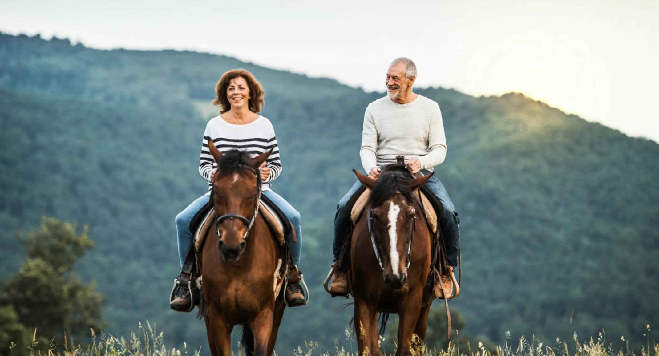 Man & Woman riding horses Man & Woman riding horses