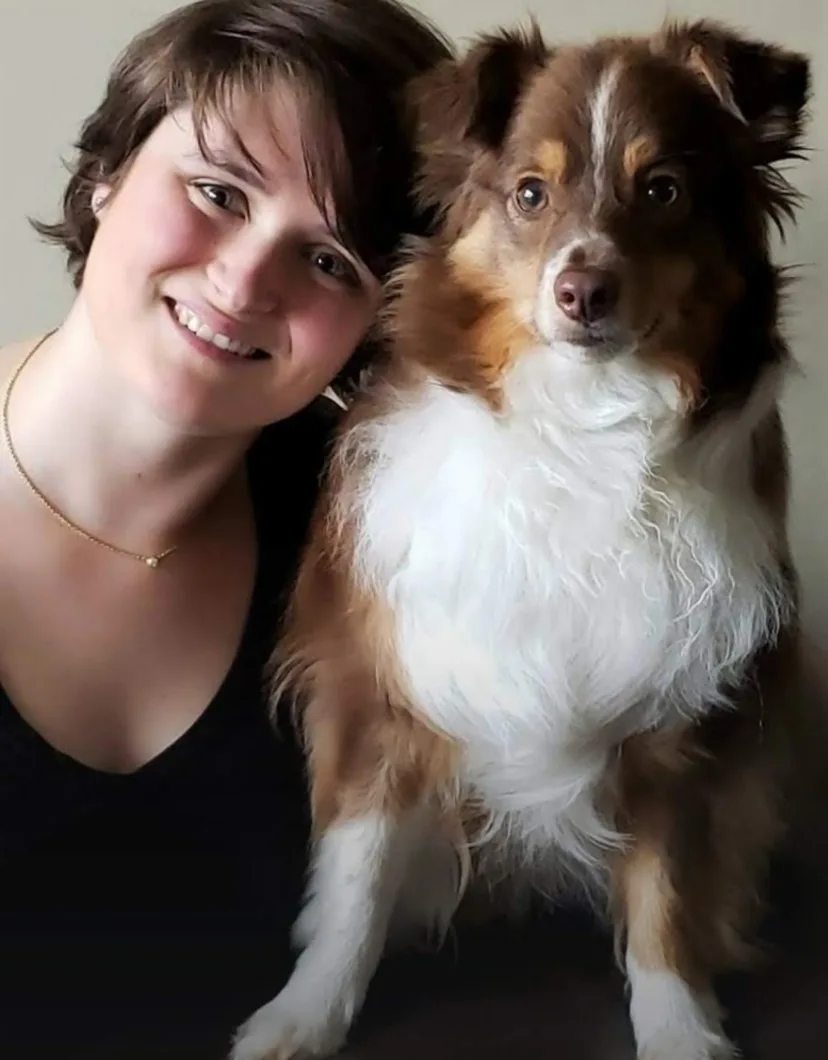 Lex, posing next to a dog