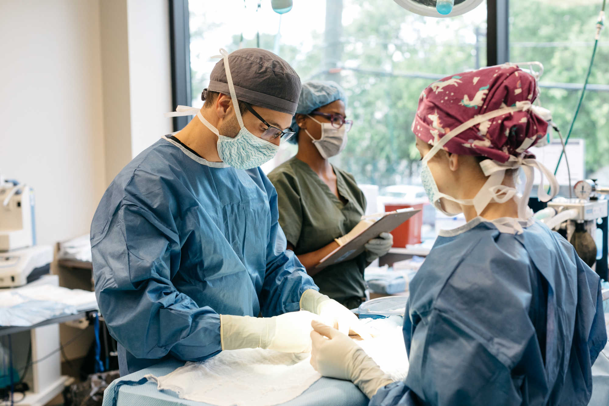 Surgeons operating on a patient.