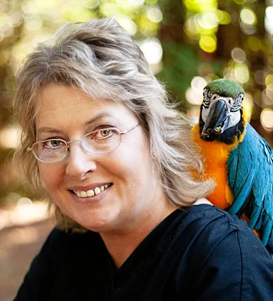 Raegan Cabral with a parrot Raegan Cabral with a parrot