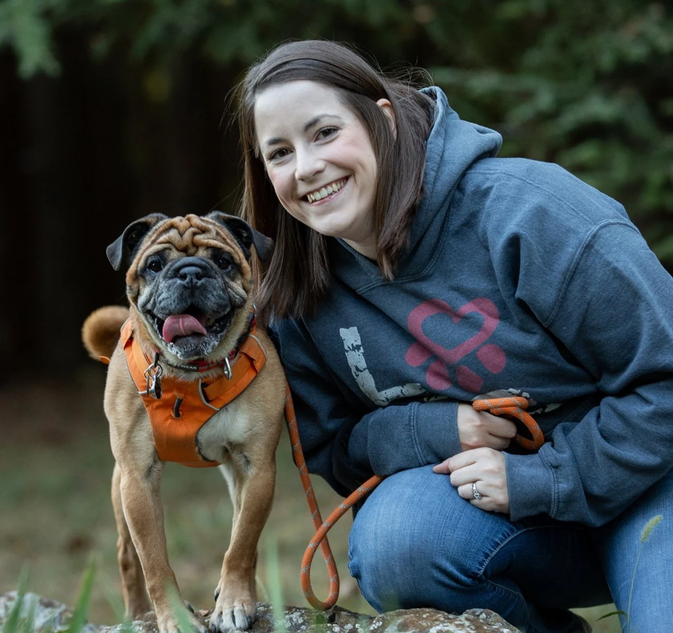 Alix with her dog in the yard