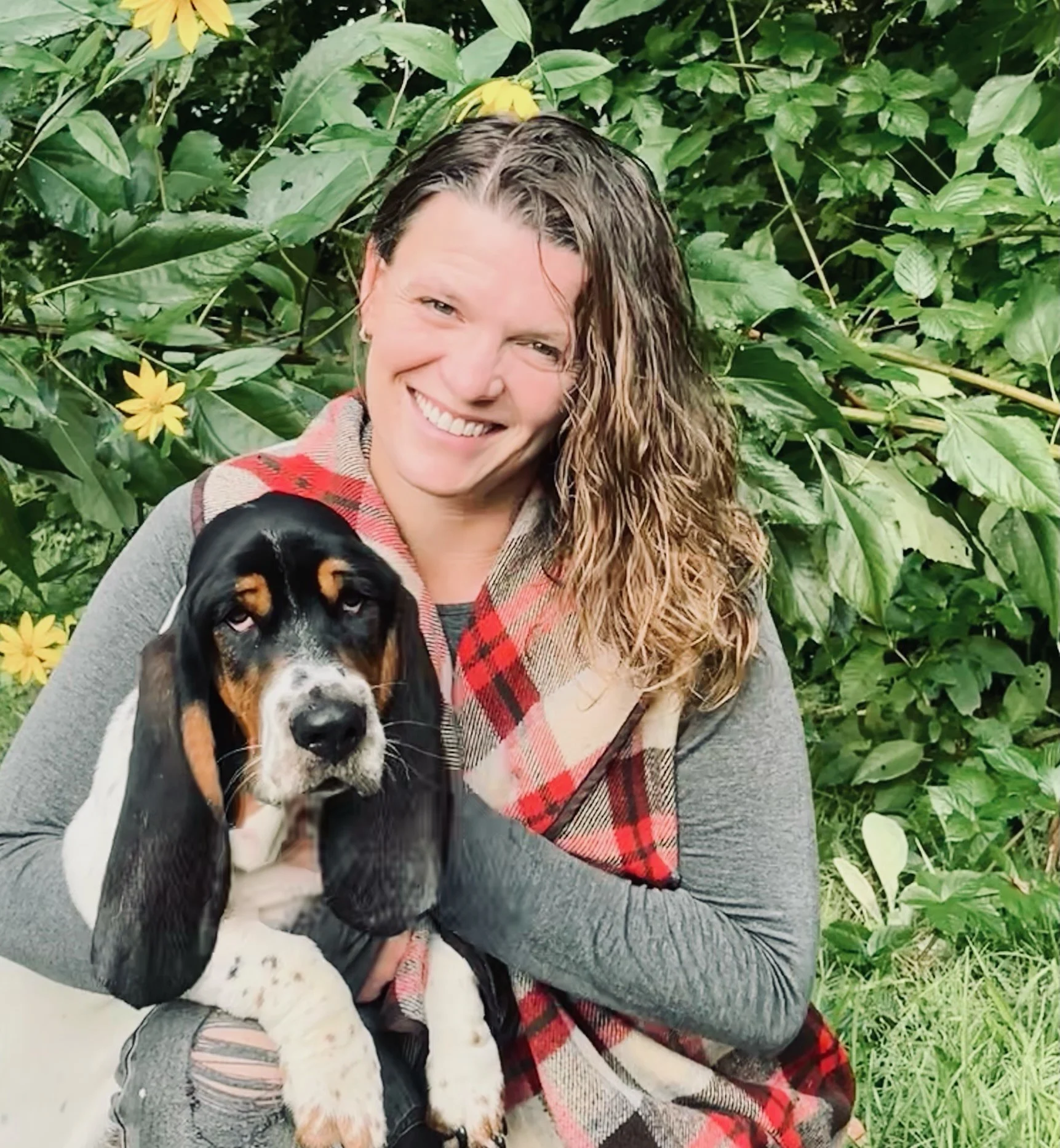 Shannon with her dog in the yard