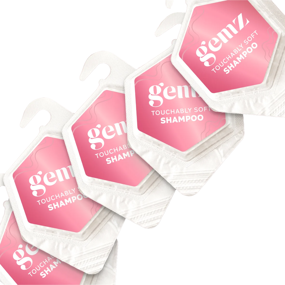 Pink and white packets of "Gemz Touchable Soft Shampoo" with hooks on a pink background.