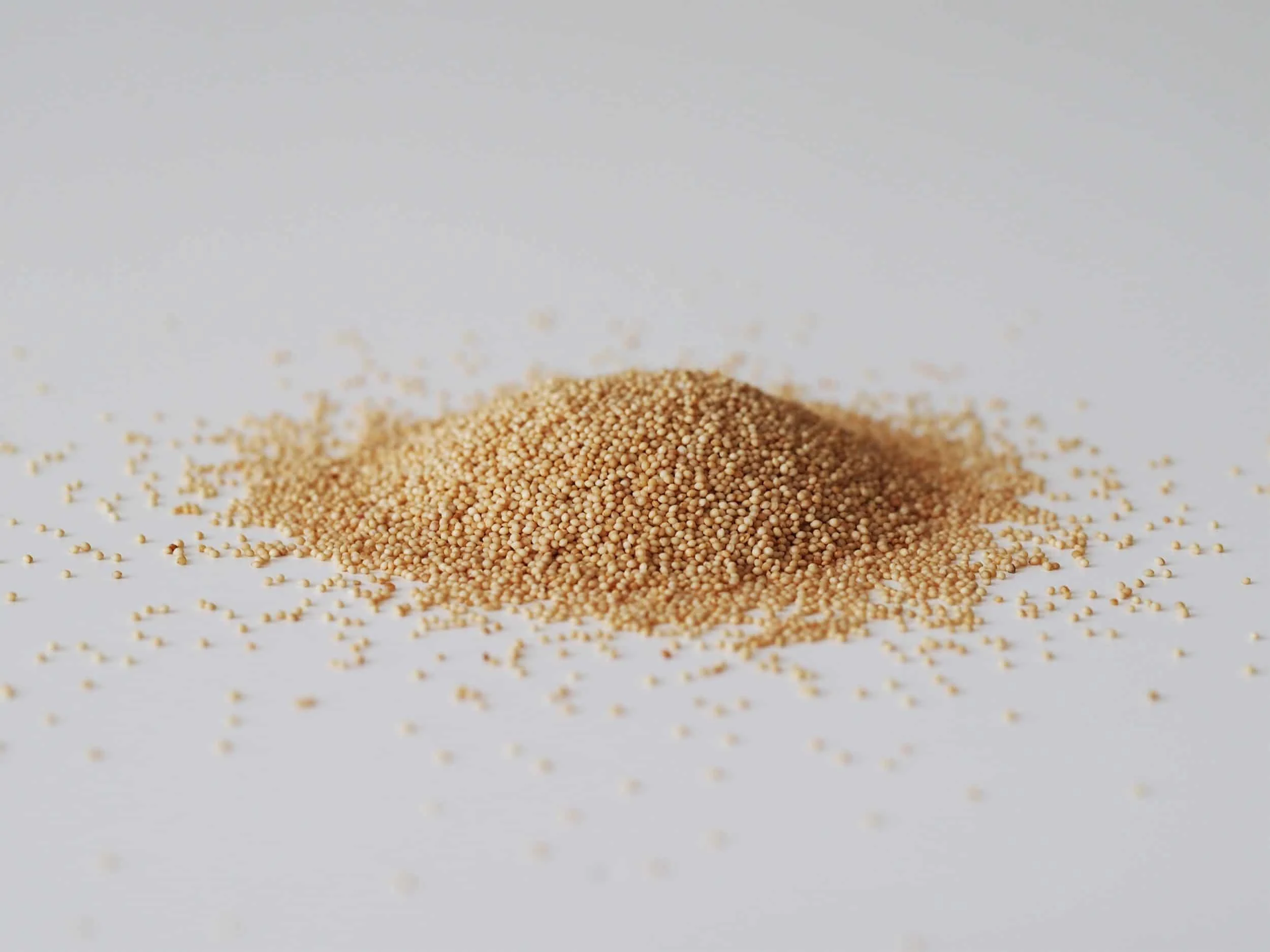 amaranth seeds on a white table before being prepared for babies starting solid food