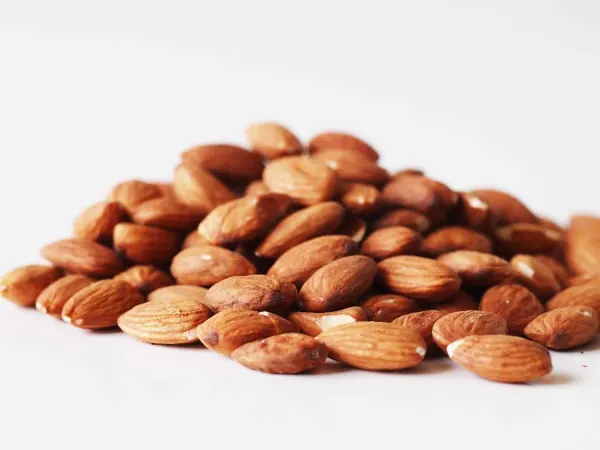 a pile of almonds on a table before being prepared for babies starting solid food