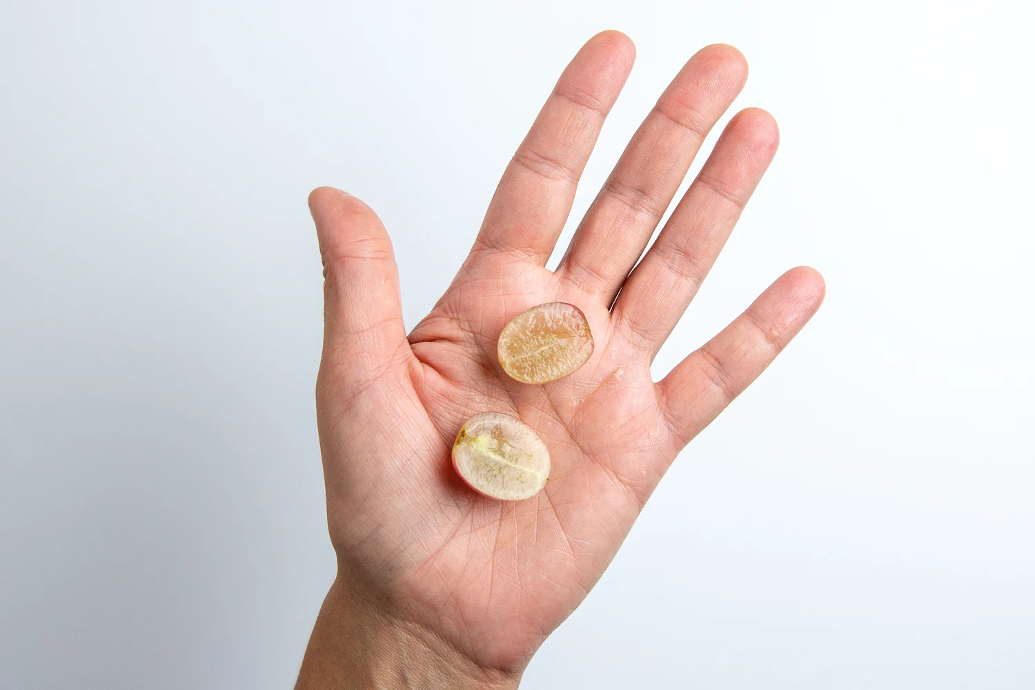 Grapes halved lengthwise hand pic