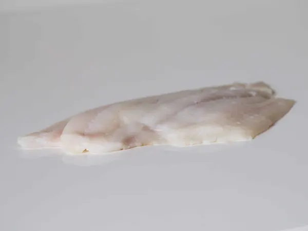 a fillet of uncooked plaice ready to be prepared for babies starting solids