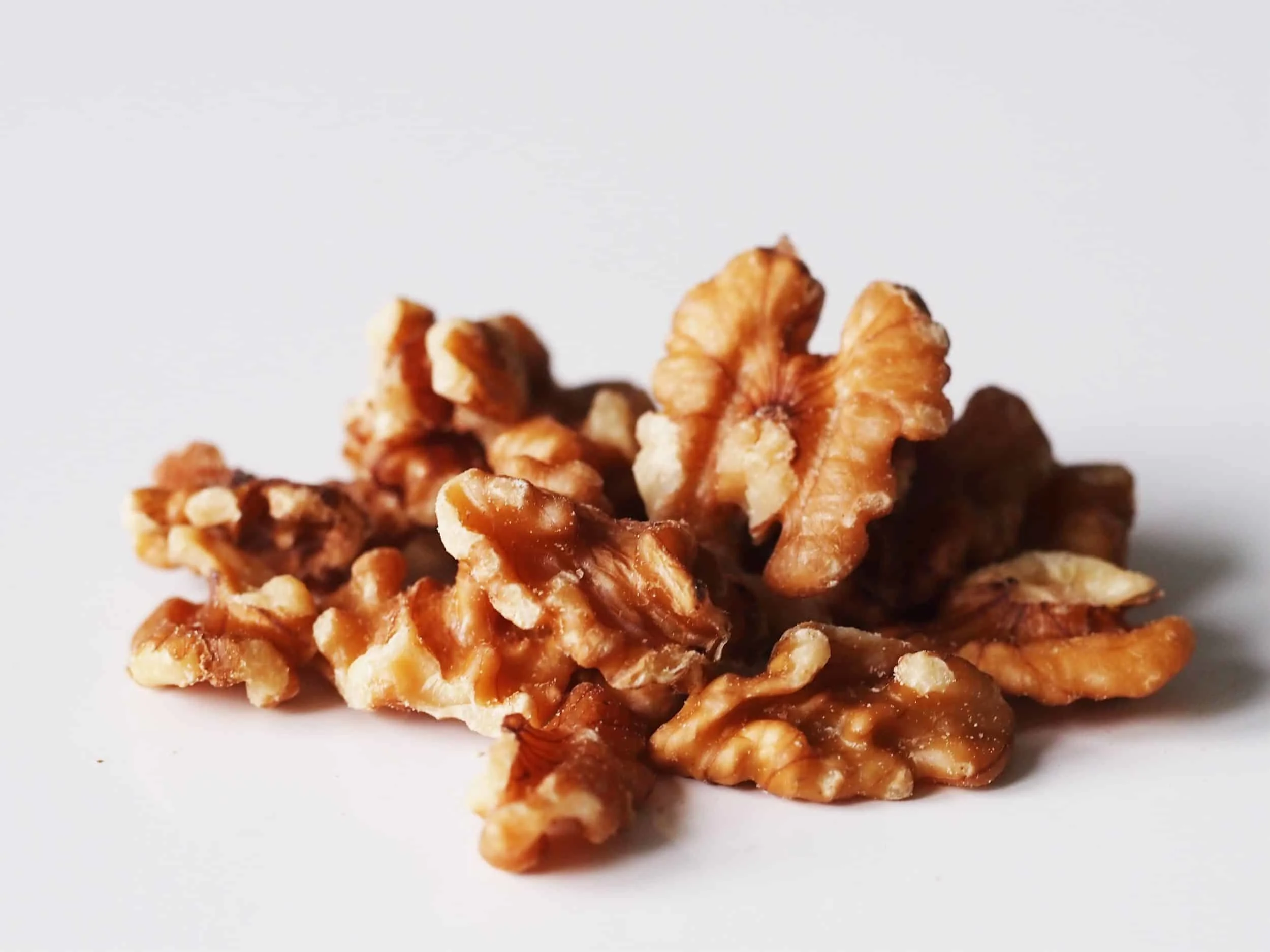 a pile of walnuts on a table before being prepared for babies starting solids