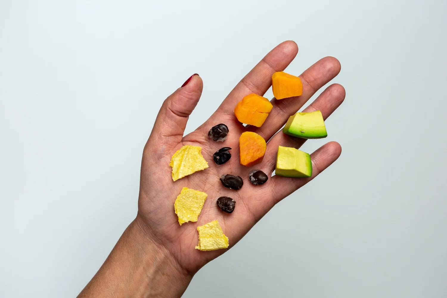 Taco bite-sized pieces hand pic