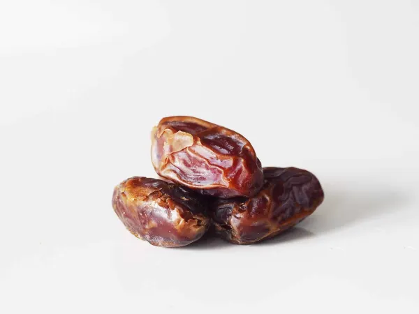 three dates on a table before being prepared for babies starting solid food