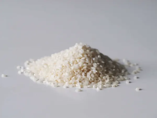 a pile of arborio rice before being prepared for babies starting solid food