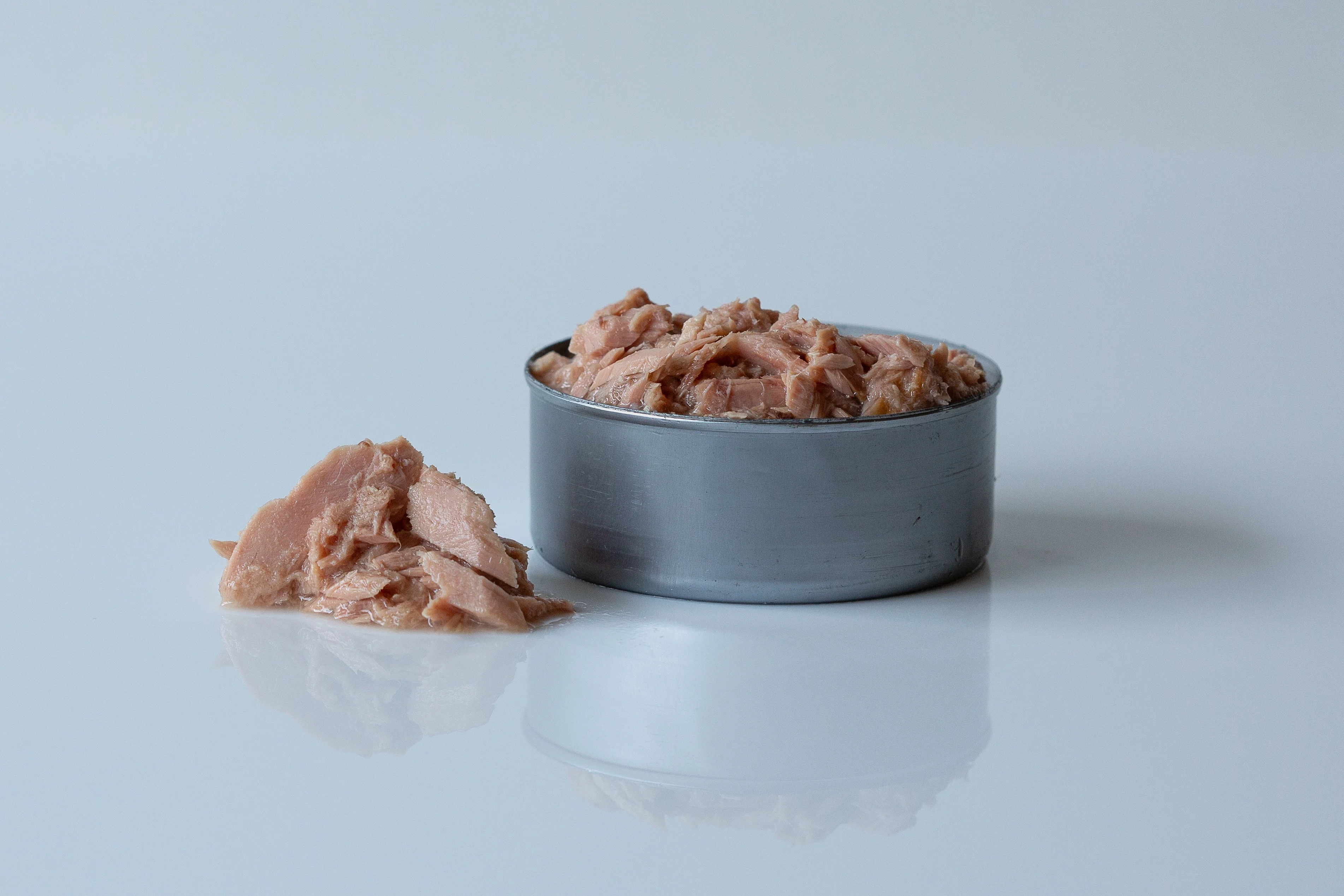 Canned tuna on a table before being prepared for babies starting solid food