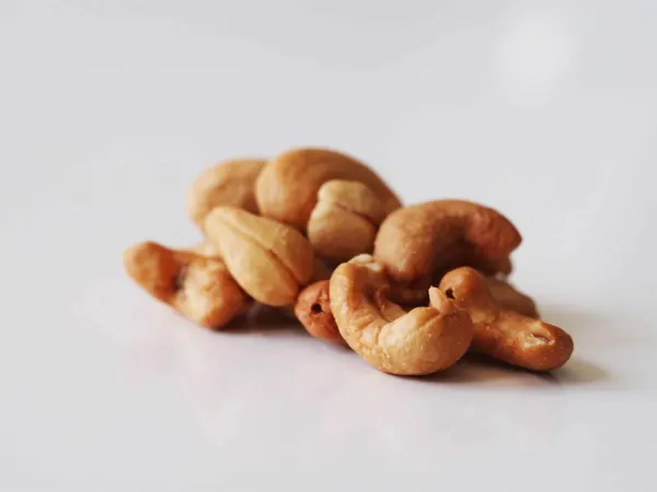 a pile of cashews on a table before being prepared for babies starting solid food