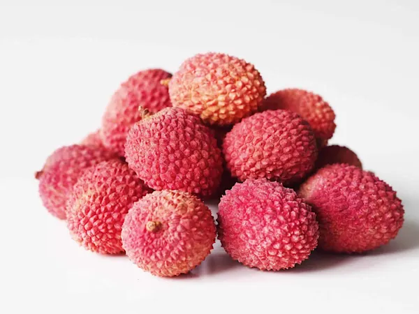 pile of lychee fruit before being prepared for a baby starting solid food