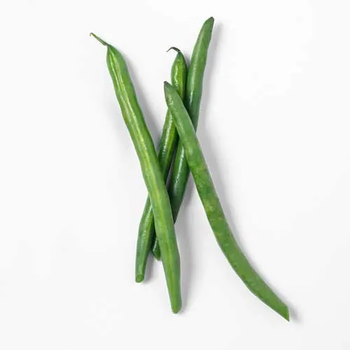 a photograph of a pile of whole raw green beans on a white background