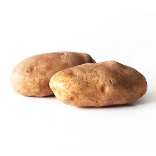 a photograph of two whole raw potatoes on a white background