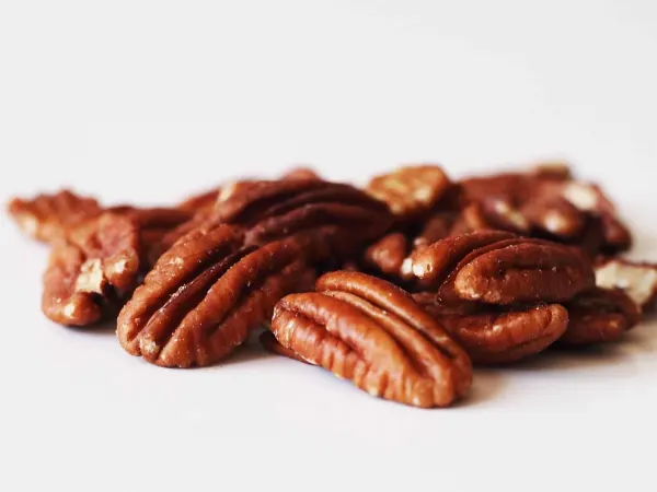 a pile of pecans before being prepared for babies starting solid food