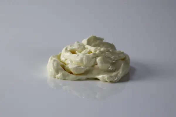 a pile of mayonnaise on a white background