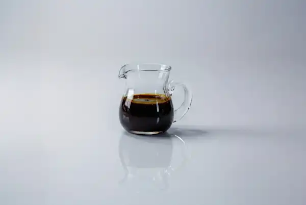 When can babies have molasses a photograph of a small glass pitcher of molasses on a white background
