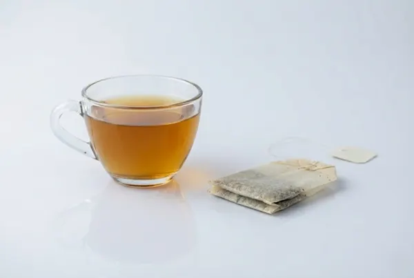 When can toddlers have herbal tea a photograph of a small clear cup of herbal tea next to an unused tea bag