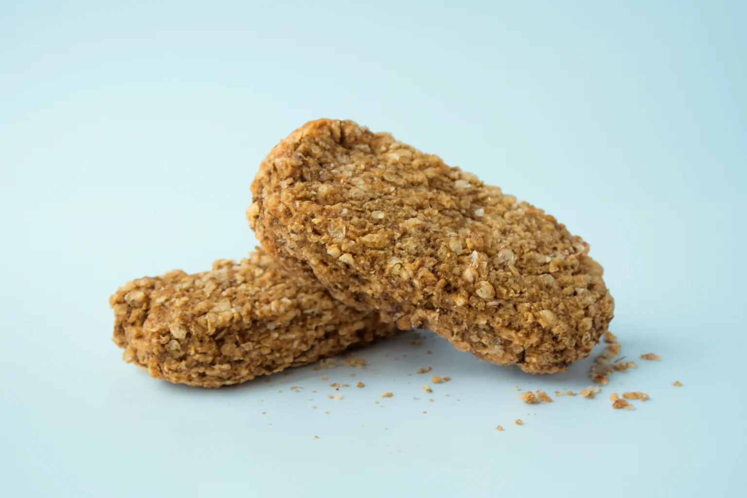 a photograph of two Weetabix biscuits on a white background