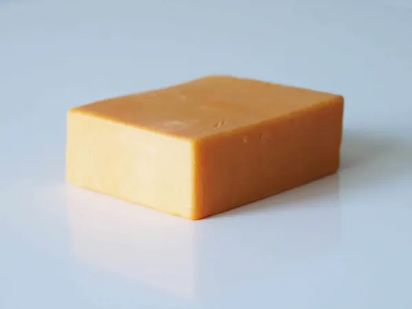 a block of cheddar cheese before being prepared for babies starting solids